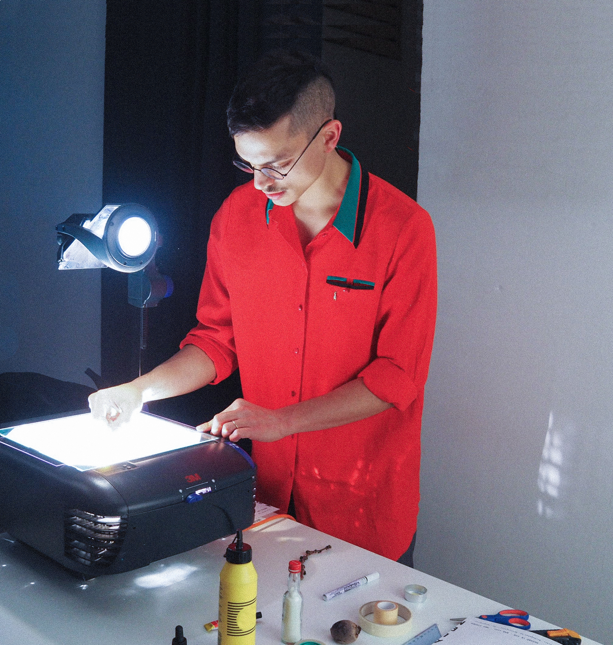 Sssimone Gaglione working with a light projector.
